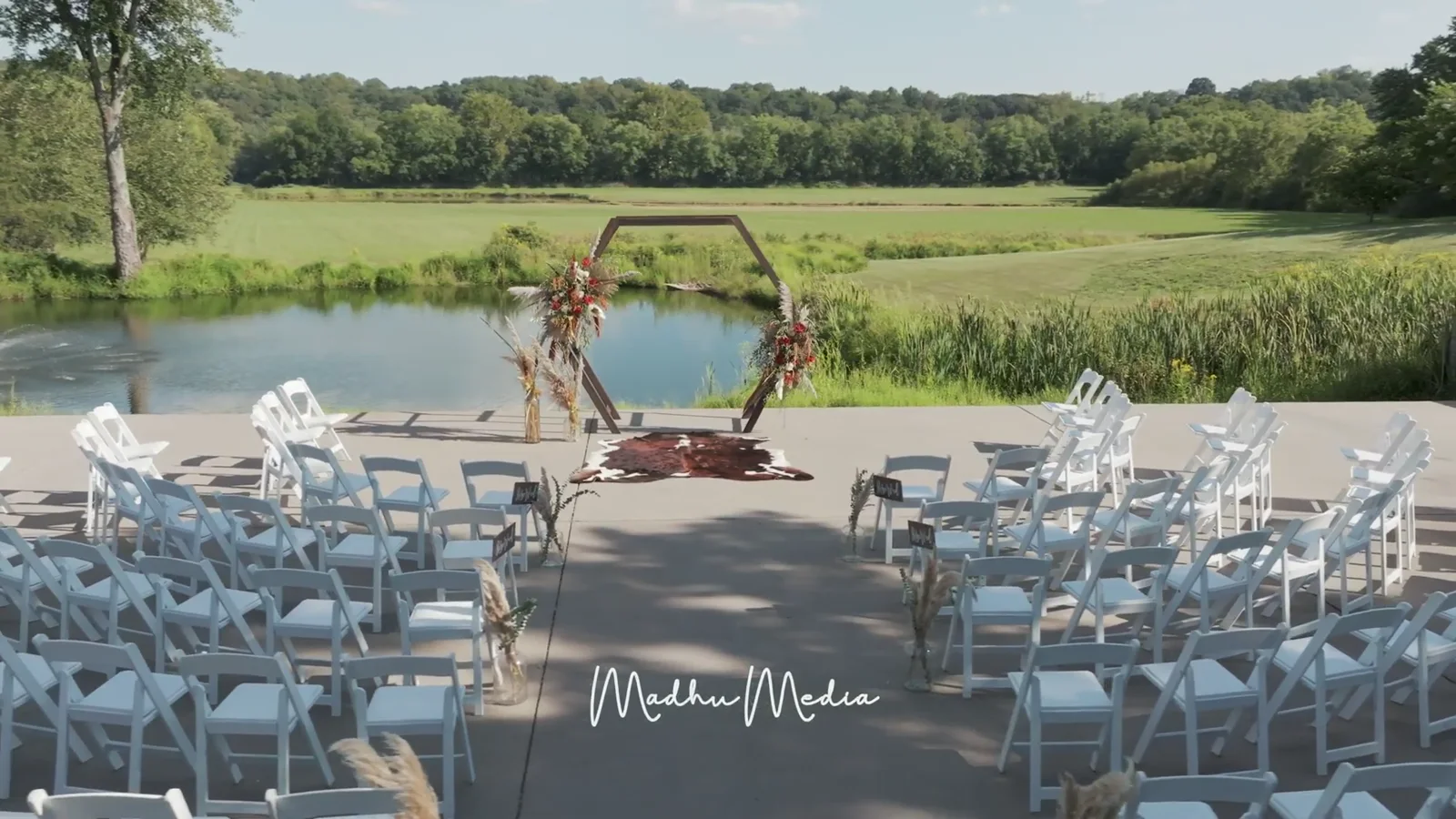 Aerial view of a lakeside venue captured by Madhu Media