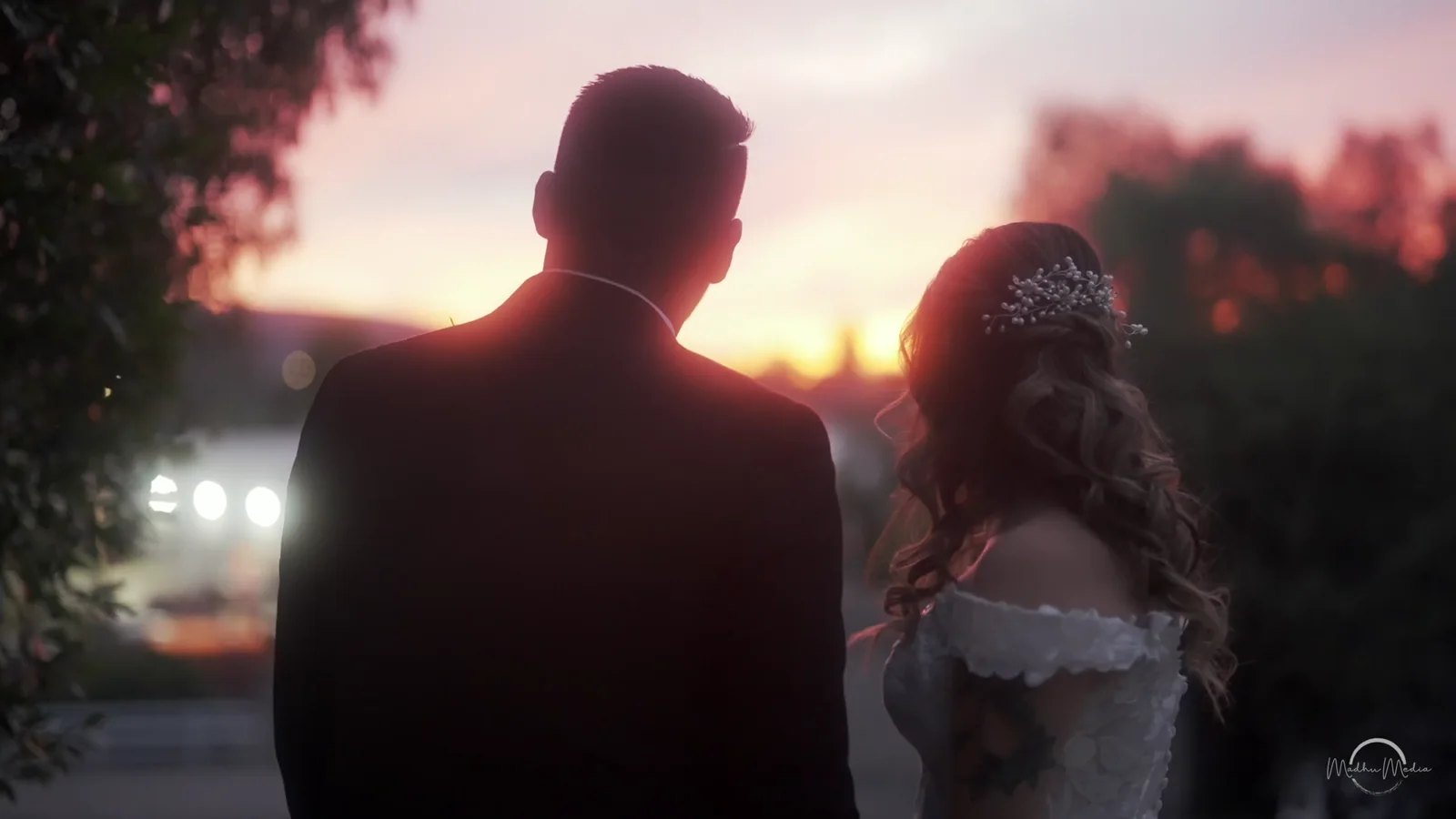 Bryan and Krystal silhouetted against the sunset