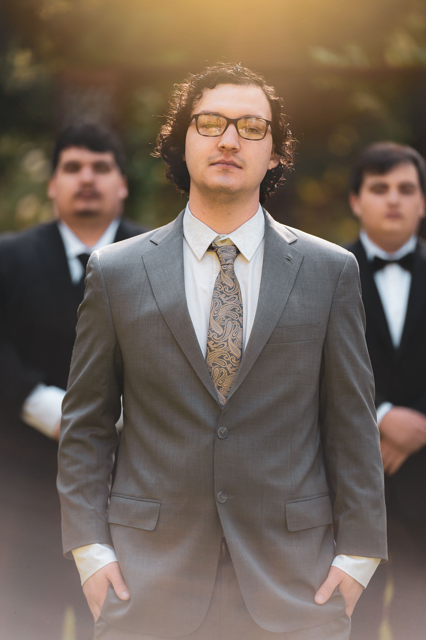 The groom front and center, his groomsmen behind him
