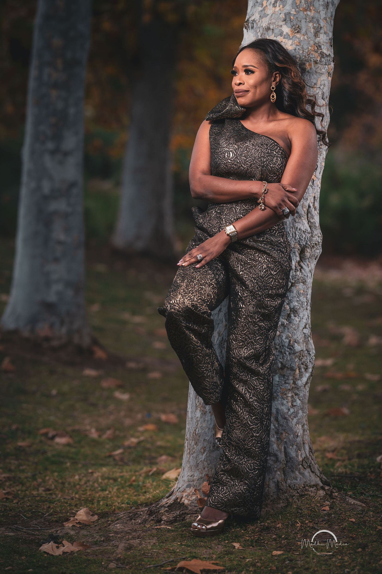 Evening portrait in a sequined gown under the sycamores